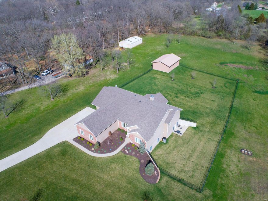 This beautiful 4 bedroom, 3.5 bath, custom built, sprawling ranch is the home you have been waiting for. Gorgeous vaulted ceilings in the great rm & hearth connected by a see thru fireplace that flows into the top of the line kitchen. Truly a chef's dream kitchen featuring Monogram GE stainless appliances including 6 burner+griddle gas range w/hood, convection microwave dishwsher & built in refrigerator, cust softclose cabinets, quartz counter, island & walkin pantry. Take your pick at 1 of 2 main floor master suites. There is no wrong choice as both feature custom walkin closets, dual sinks w/quartz counters, walkin showers & coffered ceilings. Finished walkout LL could be used as additional living quarters w/2 bdrms, kitchenette/laundry, wetbar & recrm. 3car attached oversize garage &outbuilding 40x30. Level fenced yard is perfect for HORSES kids, pets, or just to enjoy the beautiful scenery. Tucked away on Forst Drive you get the feel of the county but still close to all amenities.