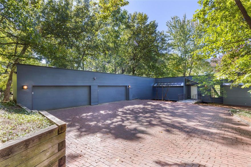 Modern elegance dovetailed w/contemporary architecture transcending styles & fashion. In a word, Obsession. Set amongst 3.21 acres, enjoy peaceful living & warm sense of community. One-of-a-kind masterpiece bringing a lifestyle of calm & nature within the streets of Kirkwood. Once in a lifetime opportunity to own over 4000 sq ft of artistic inspiration, open floorpan draws you in, interior flows effortlessly from living space to a wall of windows spanning 48-feet for panoramic views flooded w/natural light overlooking garden of eden; your own slice of serenity. Sleek kitchen connecting great room & outdoor patio for al fresco dining. Drenched in sophistication, main floor primary suite easily mistaken for mountain chalet perfect for watching seasons change. Lower level complete w/2 beds, 2 baths, family room, 2nd laundry & walks out to a stunning pond w/bronze statue. 4 car attached garage, 3 fireplaces, every inch meticulously restored & cared for. Live your dream, this is the one.