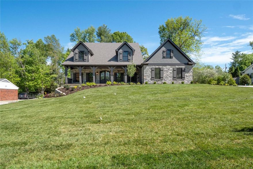 This newly built home in highly sought-after Ladue is on a private cul-de-sac street. Main floor master suite with coffered ceiling, luxury master bath with a free-standing tub, a large custom marble shower, heated floors, and a huge walk-in closet. High-end kitchen with breakfast room, large center island with storage and seating, Wolf and Sub-Zero appliances, walk-in pantry, and a separate wet bar area with an ice maker and wine/beverage center. The kitchen opens freely to a wonderful family room with 12' box-beam ceiling, stone fireplace, & built-in bookcases. Separate dining room and office with custom built-in bookcases. Family foyer area off of the oversized 3-car garage side entry has built-in cubbies and flows freely to an oversized laundry/activity/craft room with built-in desk. Second floor has 3 beds and 3 full baths with walk-in closets. Outdoor living areas include a 10' x 41' front porch and a 20' x24' covered rear patio with a stone fireplace and stained vaulted ceiling. Additional Rooms: Mud Room