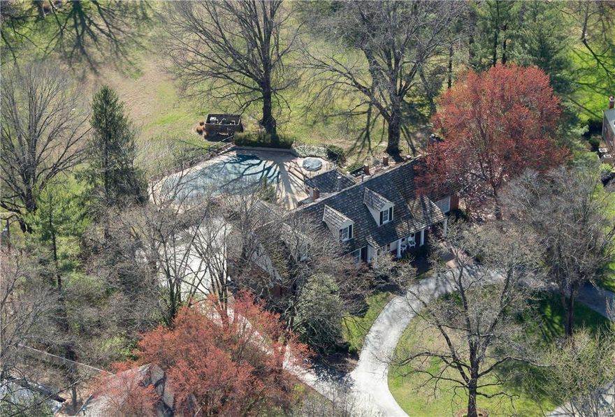 New Price on this 1.5 story traditional home, makes home ownership on one of Frontenac's most powerful addresses, Countryside Lane, a closer reality and now within reach. Situated at the furthest and most private end of the cul-de-sac. Resting on just under 2.0 level and flat acres, this 5 Bedroom /6Bath home can be one of the finest entry-level opportunities to experience this prestigious lane, or may be one of the very best and most distinguished lots in a picturesque, bucolic setting; one that is completely private with unobstructed views. In close proximity to some of St Louis' highest status new construction properties, this  5,000SF+ total living area property also enjoys a private pool and deck, secluded from all neighbors. 3 bedrooms on main + 2 bedrooms and living area, om 2nd. Master Suite features organized walk-in closet and heated floors in Master bath.  Eat-in kitchen and breakfast room. Above grade, finished walkout lower level is equipped with bar and fireplace.