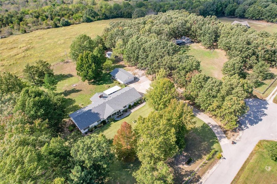 Beautiful home just minutes from town. This quality-built 3-bedroom, 2 full bath home features 2499 sq ft on 1 level, just under 4 acres, hardwood flooring, quartz counter tops & oak cabinets in kitchen, sunroom and formal dining room. All rooms are spacious and have large/roomy closets. Updates include all new light fixtures, interior paint, ceramic tile in living room, sunroom & guest room, new windows in sunroom, faucets, and hardware. Newer water heater, stainless steel appliances, and handicap walk-in shower. Outside offers just as much with a large, covered deck to hang out on and watch the beautiful sunsets, a detached 2 car garage with extra storage/hobby room, shed for all the yard tools, lawn mowers and firewood, 2 carports and another shop/barn for farm equipment and animals. Home is in the Joel E. Barber school district. Great location, outside city limits but just 5 minutes from downtown Lebanon! Additional Rooms: Sun Room