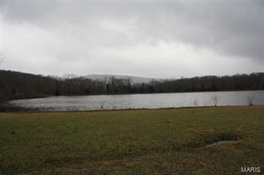 This property is 1155 acres former camp located in Wayne County north of Sam A Baker State Park. Property features 2 miles of St. Francis River frontage, 20+ acre lake, some open pasture for livestock, horse stables w/water, & corral.Timber has been under timber management plan. There are 21 cabins, 17 rustic, 2 w/electric, 2 w/electric & water & septic, dining lodge w/ kitchen, pavilions, camp area,amphitheater, a pool & shower house. There is a 3 bd, 2 ba caretaker home w/ 30x40 shop building & barn.