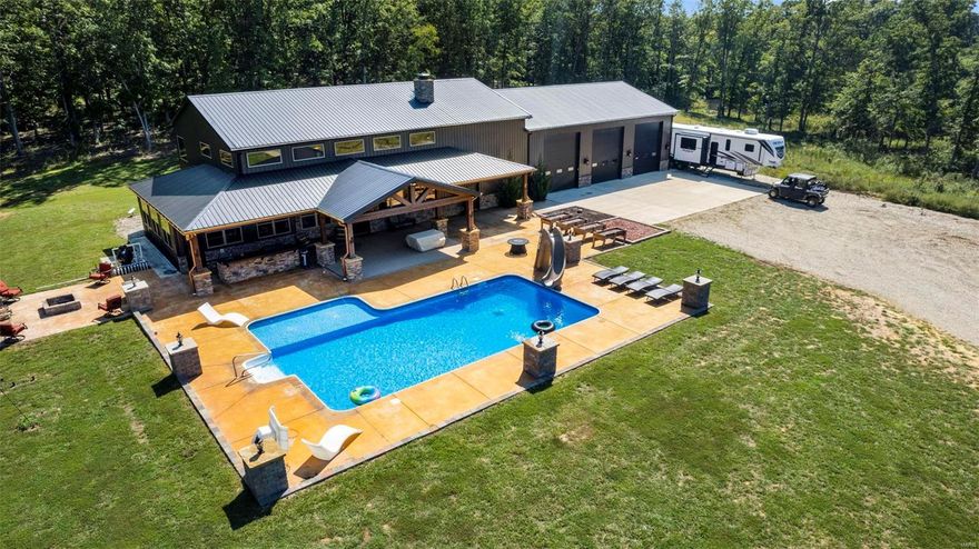 This custom built home is a showstopper! Situated on 80+/- acres the main floor of the home features two beds, 1.5 bath, main floor laundry, a gourmet custom kitchen with an oversized center island & large pantry, floor to ceiling stone wood burning fireplace, custom granite throughout, master suite with an oversized bathroom with double sinks, a jacuzzi tub, tiled walk-in shower & two large walk-in closets. There is also a concrete safe room off the master that is heated/cooled and that offers a safe place to take refuge on those stormy days. The second level of the home is where the theater room can be found along with a rec room, home office, Jack & Jill bath & two bedrooms. And if the inside wasn't enough to get you excited you are going to love the inground pool, two-acre stocked lake. For the wildlife enthusiasts let’s not forget about the hunting possibilities on the 80 acres! There are plenty of trails throughout the property for avid outdoors man to play! Additional Rooms: Sun Room