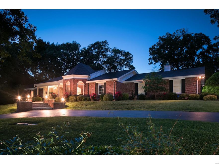 Sprawling Town & Country ranch home on a private 1 acre parklike setting situated at the end of a cul-de-sac.  This spectacular home features large rooms with vaulted ceilings and an open floor plan with floor to ceiling windows offering light-filled rooms and beautiful views.  The spacious chef's kitchen features high-end appliances, custom cabinetry, center island and opens to a large breakfast room, hearth room and outdoor living space with a Flagstone patio and stone fireplace. The elegant dining room and living room round out the many possibilities for entertaining. The main level includes a luxury master suite and master bath with heated floors. 3 additional large bedrooms, two additional full baths and one half bath complete the main level.  The enormous beautifully finished lower level includes spaces for media, billiards and gym along with a guest bedroom, office and a full bath. This home also boasts a rear entry 3 car garage, full brick exterior and circle driveway.