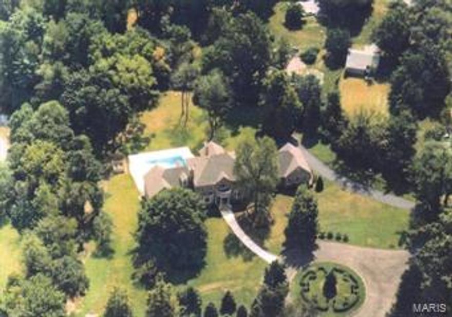 Custom designed full brick home on 1.8 private AC in the heart of Ladue. Master Suite includes study w/built-in bookcases & fireplace; his & her baths; separate heating/cooling system. 2-sty Great Rm features custom fpl & expansive Pella windows overlooking pool & yard. Living Rm w/bay window & fpl; possible library/game rm; Kitchen, Breakfast rm; Butler's Pantry; 2 Powder Rms; & Laundry Rm complete main level. Upper Level includes 4 bedrm suites each w/private baths; balcony; & Laundry Rm. Finished walk-out Lower Level includes Family Rm w/stone fpl; home theater; pool table area; full kitchen;2 full baths; bonus rm; & Laundry Rm. Kool Deck surrounds the inground pool. A lily pond & patio are off the kitchen/great rm. Additional features include a finished oversized 4-car garage; copper gutters; 3 additional zones HVAC; 2 central vacuum systems; 400 amp electric service; commercial hot water heater; some wood floors; custom wood moldings.  Ladue School District; Conway Elementary.