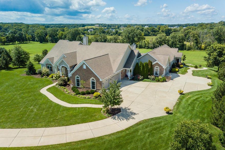 Looking for property with room & privacy for your family plus maybe your parents, grown children or private work area? This home is perfect for those who want to have a luxury home on acreage & need space for extended family or space to work from home! Enjoy fabulous Sunsets on this private, almost 4acre lot, in upscale Avondale Meadows, just off Hwys 40/64 & DD! Approx 9000 fin sqft w/5500+/- sqft of Main Level living - 4000+/- in Main House/1500 +/- in the gorgeous adjoining inlaw residence! Both offer extensive finished walk out lower levels! 5 fplcs, 3 kitchens, multiple Great/Family/Rec Rms, 7 bdrms (2 sets share J&J baths), 5 full/3 half baths! Quality features incl FiberCement siding, multiple HVAC systems w/electronic air filters, finished garages, custom landscaping/Koi Pond. Huge Patio area w/great set up for future pool! Horses allowed, w/plenty of pasture/space for Barn! Super location w/easy access to hwys, shopping & limited commute time to St. Louis County! HSA Warr,MORE