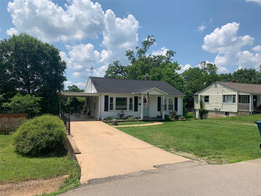 Check out this charming house with original hardwood floors, shiplap walls in the dining room, bathroom, and kitchen, and a completely remodeled gorgeous bathroom.  This house is ready for a first time homeowner or someone ready to downsize. Laundry is in the basement with the washer & dryer staying with the home.  Concrete drive with a covered carport and beautiful landscaping in a  well established neighborhood. Don't wait too long on this one.
