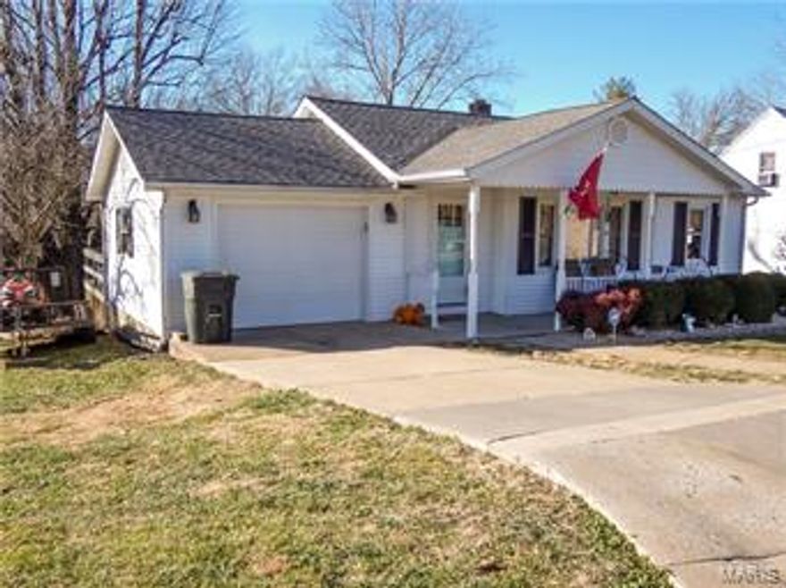 A lot of awesome-ness packed in this 1600 sq ft Hermann home! Large living room, shotgun style kitchen and separate dining room, along with 2 bedrooms and full bath on main level. Lower level has a recreation room/den, laundry area, another bedroom and full bath. Also in the lower level there are 2 unfinished areas, larger one would be great to store your freezers, and other extra supplies or seasonal items. The other unfinished area has double doors leading to the backyard and is perfect for your lawn mower, garden tools or pool equipment. The current and past homeowners have put a ton of thought into the design & decor of this property. Home has been well maintained with a newer roof and new AC in 2016. Current homeowners also added granite counter tops and painted throughout the home with a beautiful color palate. If outdoor entertaining is what you love, this property sits on 2 lots with a wonderful deck shaded by a huge mature tree and is just a few steps from Stone Hill Winery!