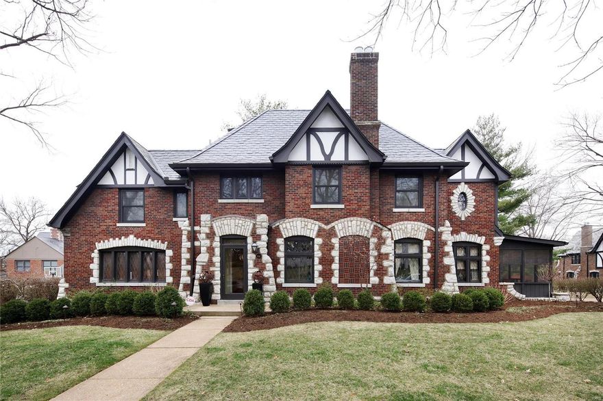 No expense was spared in tastefully updating this exquisite & immaculately maintained Clayton Tudor home.  Expansively sized rooms flow seamlessly throughout for easy entertaining.  The living room hosts a large stone fireplace, leaded glass windows & charming window seat.  The open kitchen encourages group gatherings with granite counters, a large central island with eating space, high end stainless appliances & skylights.  The adjoining family room features a gas fireplace with granite hearth, skylights & a door to the deck.  The butler's pantry boasts a wet bar, bar fridge & ample storage.  The 1st floor is completed by a 1/2 bath, breakfast, dining & laundry rooms (the latter hidden behind sandblasted glass doors), & a screen porch.  The 2nd floor features elegant master suite w/huge walk in closet & gorgeous master bath.  Three other spacious bedrooms & 2 fully updated baths finish 2nd floor.  Partially finished LL & attached 2 car garage complete this rare, move in ready package.