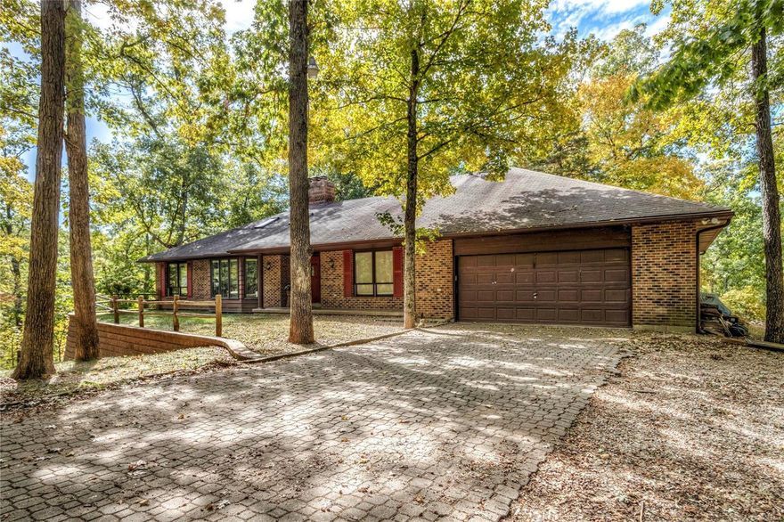 Welcome to 18649 Quarry Road! 3BR/2.5BA/4-Car Garage/Walk-out LL and an ABSOLUTE OASIS of nearly 23 wooded acres! Winding paver-drive leads you to this fantastic *all brick* home. EXCELLENT craftsmanship here--crown molding throughout much of main level. Pella windows. Rich wood panel doors/trim kit. Newer tile in foyer. Gorgeous Great and Dining Room combo with w/b fireplace plus built-in bookcases on either side, recessed lighting, skylights, 5-window bay & crown molding.  Main Fl Laundry. New in the kitchen: tile floors, dishwasher, disposal, sink & microwave.  Electric smooth-top range here PLUS a wall oven! Huge walk-in pantry. New deck spans back of home. New retaining wall @ front of home. Large Master BR (18 x 14) w/walk-in closet and full bath. Tall pour LL features huge FR, 3rd BR & half bath. LOTS of storage. Unfinished area sealed off from rest of home; perfect for woodworker. Wired for whole-house propane generator. Two geothermal units. Irrigation system. $mature timber$ Suitable for Bed/Brk