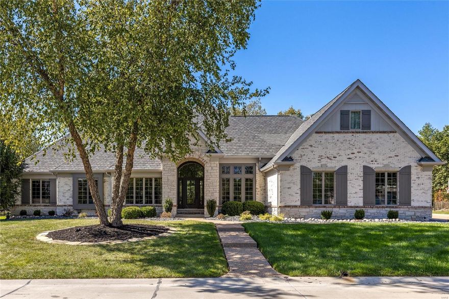 Spectacular brick & stone great room ranch from award-winning Schaeffer Homes. Open floor plan features 12’ ceilings, detailed trim work & handscraped hickory flooring that extends throughout the main living area. Impressive hardwood foyer leads to private study, formal dining room & stunning great room with box beam ceiling, brick fireplace flanked by built-in bookcases & bank of windows. Designer kitchen features glazed cabinetry, granite countertops, premium appliances & 5’ center island with adjoining dining table. Primary bedroom suite with luxury bath with shower spa plus 2 additional bedrooms & hall full bath complete the main floor living quarters. Lower Level includes recreation room with entertainment center & wet bar, gathering bar, office, workout room & full bath. Situated on parklike .74-acre grounds with outdoor living room, patio with grilling station & full-height fireplace & resort style pool with waterfall plus 2-car garage & detached garage with bonus room & ½ bath.