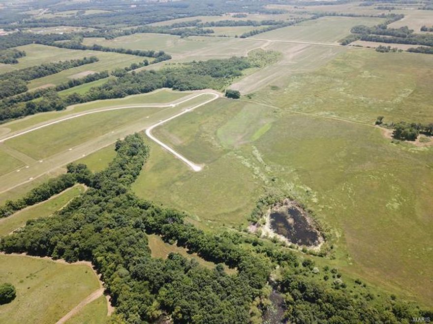Located 1 mile West off Highway Missouri J via Greenlawn Trail lies 7M01 Wood Acres Airpark. For pilots, the allure of stepping from home to an airplane without a car is a reality in residential airparks like this. Benefits include more flying time and a close-knit aviation community. Wood Acres in Perry, MO, offers a 3,200-ft grass runway and easy access to Clarence Cannon Dam and Mark Twain Lake. Today's airparks cater to diverse pilot preferences, offering serene rural living for those craving quiet country landscapes. Individual residential building lots are available, ranging in size from 3.0 acres to 3.8 acres.  Each lot has a taxi runway with access to the main runway.  The airpark is just minutes from Mark Twain Lake. Additional Rooms: In Platted Subdv.