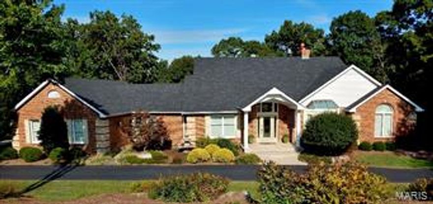 Open Sunday Sept. 27th 12-2! Meticulous Atrium Ranch shows like a display!Situated on 3 acres with circle drive, 3 car side entry garage. Gorgeously Updated Kitchen-granite countertops,stainless steel appliances, custom cabinets, gas cook-top, hardwood floors and more. Generously sized main master bedroom with view of trees, 2 walk in closets, jetted soaking tub w/ separate shower and double sinks. Private dining & living rooms open to stunning great room w/spectacular views. Entertainers delight with 2 decks, 10 ft. pour walkout finished lower level with family room, bar/kitchenette, 2 bedrooms plus 1.5 baths with plenty of room for 5th bedroom. Other amazing features are: Main floor laundry, office/den area, 2 fireplaces, custom detailed woodwork throughout, coffered, vaulted & octagon ceilings, 5 in. baseboards, hardwood floors, newer roof, newer HVAC, updated lighting, flooring and more. Must see & move in ready! Rockwood Schools!