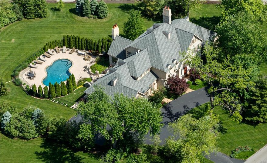 For the right buyer this will be the best value in all Mid-County. This elegant home in newer construction offers an open floor plan and over 8,500+ SquareFeet of the finest finishes possible. KMOV TV4 Great Day St. Louis, filmed its segment "Finest Luxury Homes of Saint Louis", and featured this outstanding home as one of 5 chosen from all St. Louis area properties. The setting is private with meticulous landscaping. Details include custom millwork, stonework, ironwork, wide plank pine floors, vaulted ceilings, Venetian plaster and rough hewn beams. The salt water pool creates a resort lifestyle w/ surround sound, firepit, patios & terraces. Full-line Viking kitchen with main level wine room. Master Suite on 1st level plus 5 BRs, all suites. Lower Level complete with Home Theater, performing stage & lighting, gaming and card rooms, full bar and exercise room. 6 Bedrooms, 9 Baths, total. Convenient location; only steps to Mercy Hospital, I-40, Ballas and Clayton Roads.