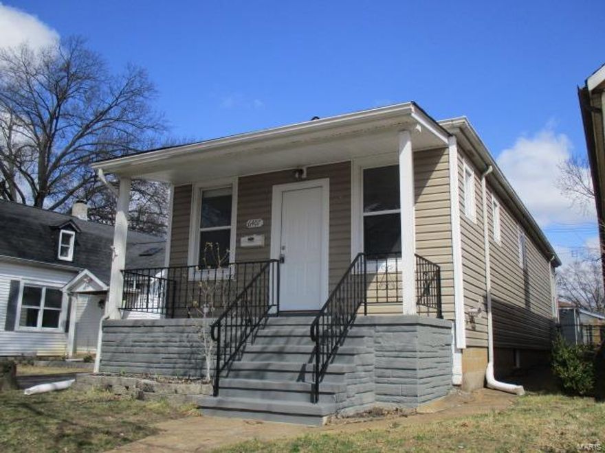 WELCOME HOME!!! A COVERED FRONT PORCH WELCOMES YOU TO THIS RANCH/BUNGALOW STYLE HOME.  HOME FEATURES A LARGE OPEN FLOOR PLAN FEATURING LIVING ROOM AND NEWLY INSTALLED KITCHEN WITH TONS OF ROOM FOR DINING.  DOWN THE HALL YOU WILL FIND A FULL BATH AND LARGE MASTER BEDROOM WITH BUILT-IN SHELVING.  BACK STAIRS LEAD TO FULL BASEMENT WITH OPEN AREA AND WASHER/DRYER HOOK-UPS.  BACK DOOR OPENS ONTO PATIO IN PARTIALLY FENCED YARD WITH WALKWAY LEADING TO DETACHED 1 CAR GARAGE.  FANTASTIC FOR OFF STREET PARKING IN THE CITY!  HOME HAS UPDATES GALORE...*WOOD FLOORS, LIGHTING, KITCHEN, BATH FIXTURES, FRESH PAINT, CARPET, HVAC, WATER HEATER AND ROOF*  TAKE A LOOK TODAY!