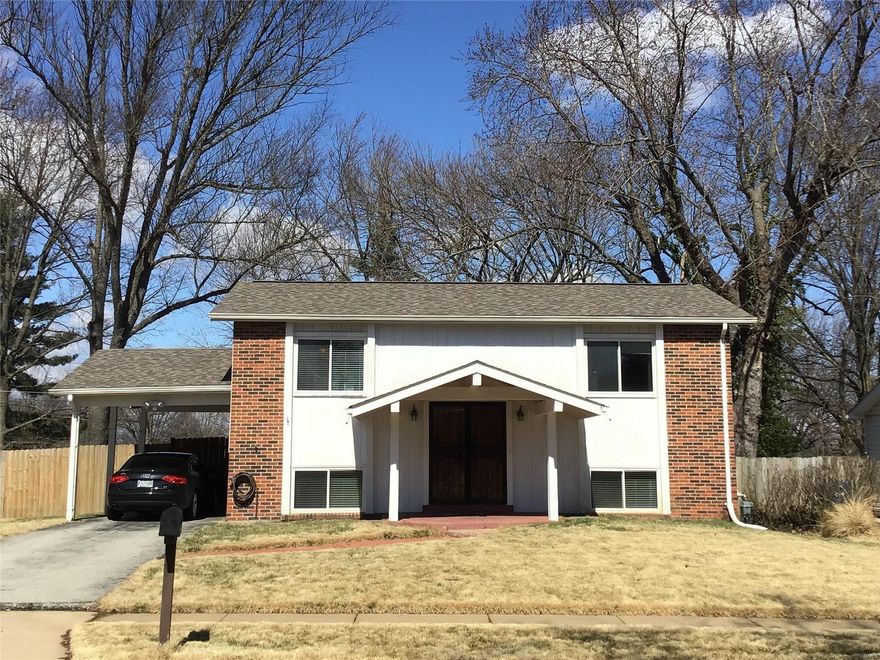A home owners delight! Come sit on the deck & enjoy the views of this 3 bedroom, 1.5 bath home. The large open living room with hardwood floors lead into the dining room & kitchen. The kitchen boast of tile floors, stainless steel appliances, newer windows and a pantry. New solid 6 panel doors throughout the house and a hallway linen closet with a 3 panel door. Newer frame and sliding glass door window unit was replaced off the dining room. Large deck was installed in 2016. 2 bedrooms and updated bathroom are on the main floor. The 3rd bedroom is located on the lower level. A large family room with a walk out and sliding door lead to the spacious backyard. Full bath is located on the main level with an updated half bath on the lower level. Laundry room is located on LL with plenty of storage space and has a separate door to the back yard. 1 vehicle carport and front covered porch. Whole house water softener and whole house water filter system installed in 2017. Newer roof 2015.