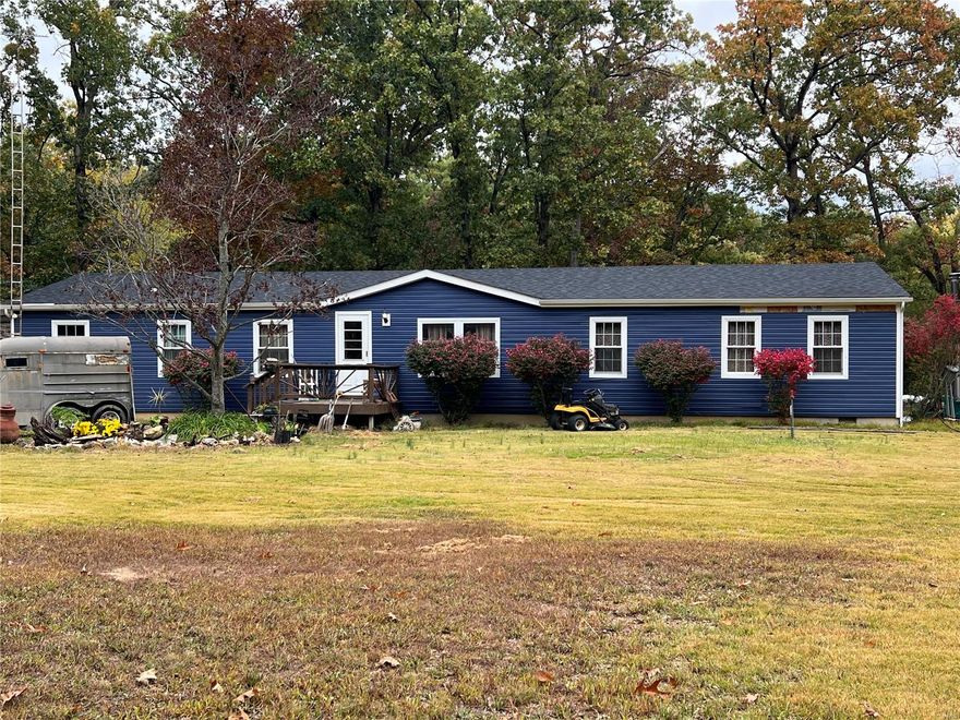 Don't pass this home up. What a great opportunity to live on 5 peaceful acres of land. This 4 bed 2 bath home offers privacy & country living at its finest. Spacious 2000+ sq ft of living space.  Shed/outbuilding with electric and concrete floor. Huge deck overlooking fenced yard with a view of the pond. Chicken coop and coy pond ready for you to stock with your favorite friends. There is a four seasons room that would be amazing with a little bit of fixing up. The home has some newer windows, new siding and newer roof. Septic has been replaced. The home needs a few updates and a little TLC however it has been priced to sell. Home is being sold as is in its present condition seller to make no repairs nor provide any inspections or warranties. The home is less than 10 minutes from I-70. Schedule your appointment today!!