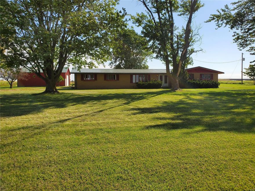 Great Opportunity! Nice all brick ranch home on 8.8 acres. Located west of Hannibal on Hwy 24 in the Palmyra school district. Home sits on 1 acre lot with 7.8 acres of farm ground surrounding. Property has a large 40x40 metal building with concrete floor near home. Currently on well but has access to Rural Water.