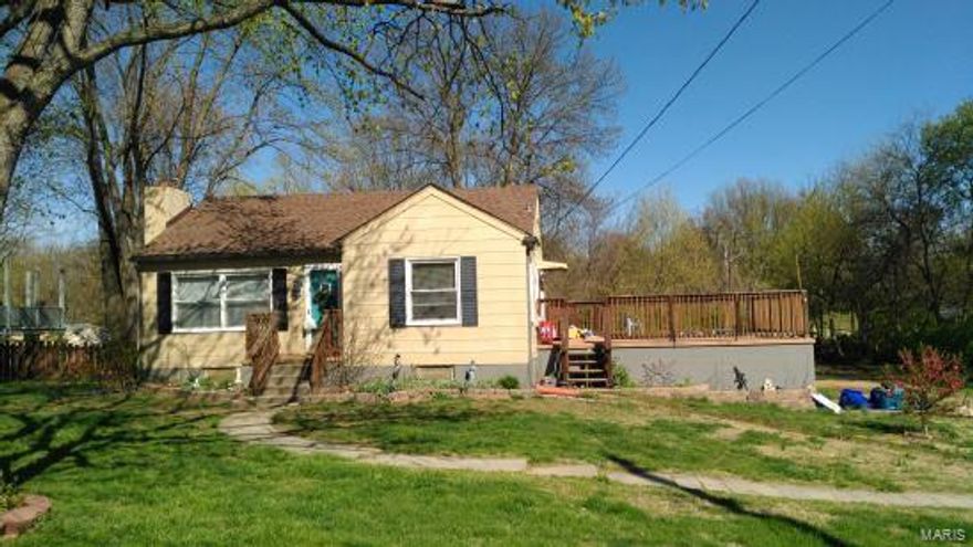 Nice home on 1+ acre lot, bring your horse. Features lovely hardwood and tile floors, wood burning fireplace, remodeled bath, large picture window in living-room, 20x20 deck off kitchen, additional wood deck where 20+ foot above ground pool was. Also newer horse stall. Creek runs through back of property. Nice setting.  Located in  area of much larger homes and could make a good place to build new if desired. Priced very well . New double overhead garage door May 2016. Great for young single or couple or empty nester. Like living in the country with city amenities. Listing agent is seller's 2nd cousin. Furnace, central ac, and water heater approximately 3  years old. Newer architectural shingled roof approx. 2012.