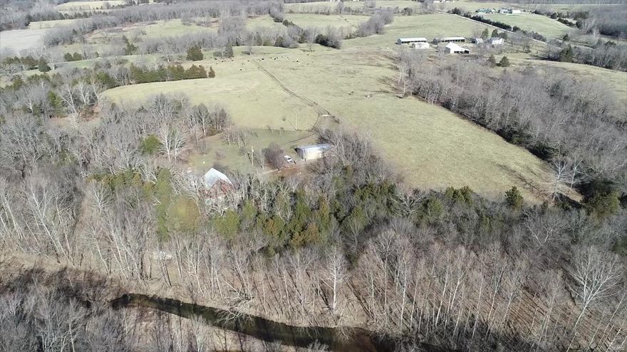 Farms like this rarely come available for sale in Phelps County. Gorgeous 246+/- acres of mostly open ground has 3/4 of a mile of the Little Bourbeuse that runs through it. This working farm has 120 acres of river bottom, 58 acres of woods, and 68 acres of pasture. Four natural springs and multiple auto waterers located throughout the property. You will love the authentic white oak log cabin. Built in 2005 it has 3 bedrooms, 2 bathrooms. Perfectly situated to walk down and go fishing or enjoy the beauty siting on the wrap around deck. Separate detached garage with workshop and lean-to. The original 120 year old, 2 story farmhouse is currently rented. Property includes large barn, machine shed, and (2) pole barns. This is an exceptional piece of property with so many possibilities!