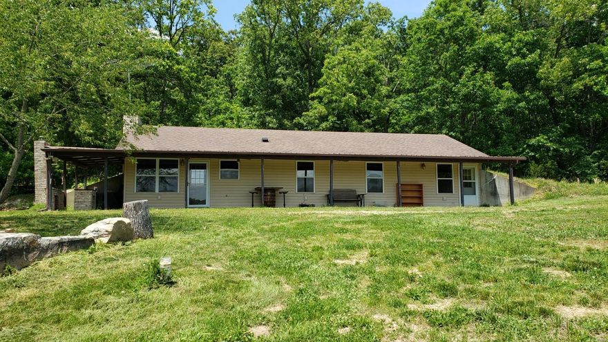 Beautiful & picturesque 51 acres for your consideration. 3 Bed 2 bath home w/ covered front porch to enjoy the view of the stone fire pit, pond & the hills beyond. Large detached Outbuilding w/ overhead door for equipment storage & carport. This property can serve many purposes. Bring your family, Atv's, pets & hunting friends to enjoy the weekends on the trails, hunting, & fishing, cooking on the brick outside grill or bring your family & make this oasis your primary residence! The owners have made many improvements recently to the property including: New gas stove, range vent, & microwave. New master bath vanity, sink, toilet, & shower doors. New solid doors throughout the home. Stocked the pond w/ (100) 12" catfish, (50) largemouth bass, (500) bluegill, & different bait fish. The fish have been fed high protein pellet food every year since stocking. Ran electric to pond for aerator to create oxygen in the pond. Created (2) Whitetail Institute clover food plots. This is a rare find!