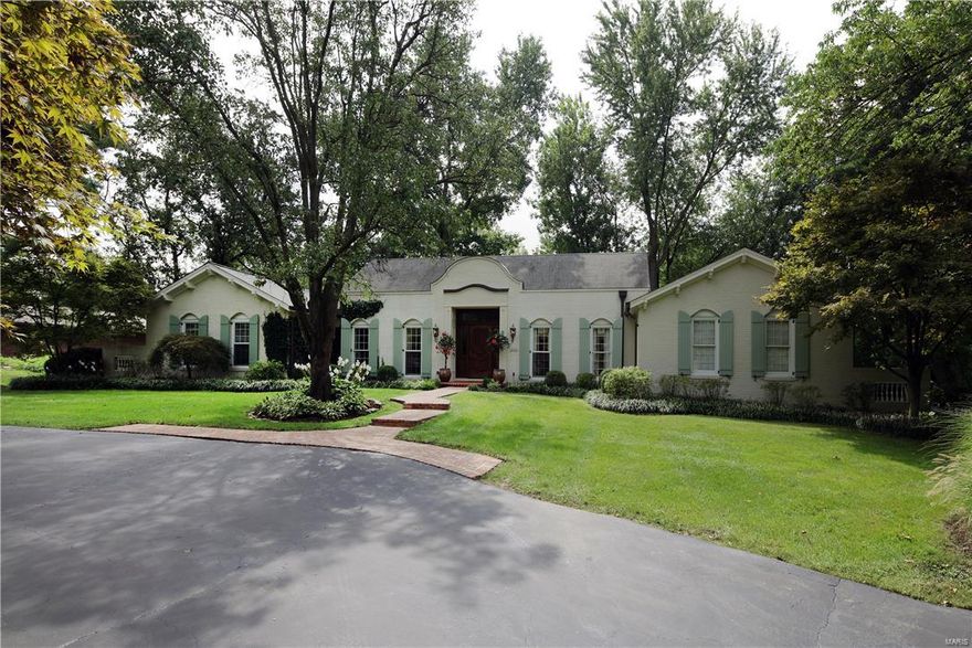 Charming 1.5 story home offering a main level master bedroom suite, situated on a beautiful private tree lined lot, almost an acre with a pool, located in Frontenac, Ladue school district. Flowing center hall floor plan, approximately 3,942sqft, featuring formal and casual spaces, updated for today's lifestyle. Dramatic entry with open staircase and marble flooring, dining room, living room with beamed ceiling, white oak plank detail and stone fireplace, family room with vaulted ceiling and wet bar, kitchen with custom cabinetry, center island, granite countertops, breakfast room, light filled sunroom opening to the patio and pool, laundry room, powder room, master bedroom suite with vaulted ceiling, walk-in closet, and luxurious master bath complete the main level. The second level offers two bedroom suites with full baths. Finished lower level: recreation room, possible 2 bedrooms, half bath, storage. Lushly landscaped yard, brick patio, winding walkways, inground pool. 3 car garage. Additional Rooms: Sun Room