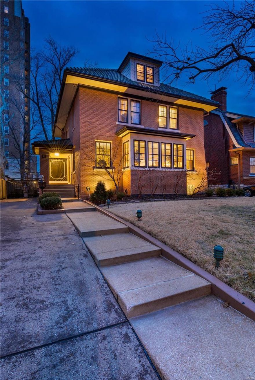 Architecture, stature & location, no other compares. Once in a lifetime opportunity to own a piece of St. Louis History. Perfectly situated on one of the most Iconic Enclaves in St. Louis, Hillcrest Neighborhood, walk to all you wish to do~Forest Park, ice cream, acclaimed restaurants, all within a few blocks. Vibrant living among the most beautiful surroundings creating a life beyond your wildest dreams. Architecture showcasing finest in old-world ornate craftsmanship. Soaring ceilings, elegant foyer, living room w/wall of windows for sun filled rooms, large formal dining room w/stunning crystal chandelier, stately original staircase. Kitchen opens to family room, wood burning fireplace~perfect for large gatherings & holiday magic! Over 3600 sq ft ready for next stewards to love & care for the home. 4 beds/3 baths, L/L unfinished & adorned w/secondary kitchen. Primary suite w/custom closets, private office/den, 3rd floor w/full bath, walk-in closet, 4th BR. In a word, Spectacular.