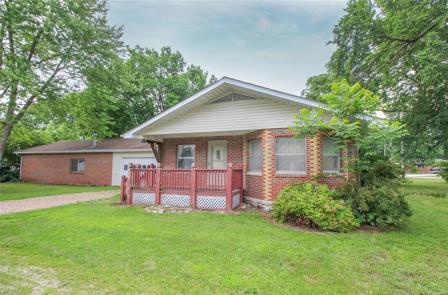 Looking for a home with an enormous shop/garage, you found it! This 3-bedroom, 1.5-bathroom home sits on almost a 1/2 an acre, corner lot with a parklike setting and located right in the heart of Old Monroe. From the covered front porch, you are greeted with an open floor plan and plenty of natural lighting that flows between the great room featuring high ceilings, a wood burning fireplace and large bay window to the adjoining kitchen and dining area. Down the hallway you'll find the master bedroom with a half bath, 2 other bedrooms, a full bathroom and main floor laundry room.  The shop is a must see! It measures 62’x26’ with a furnace, workbench, storage, a side entry service door and garage doors located in both the front and back. Use this space as an attached 2 car garage with an adjoining workshop or open it up as one BIG shop that can easily hold 6 cars. Property is being sold as is, seller to do no inspections or repairs. Great opportunity to transform this home into your own!