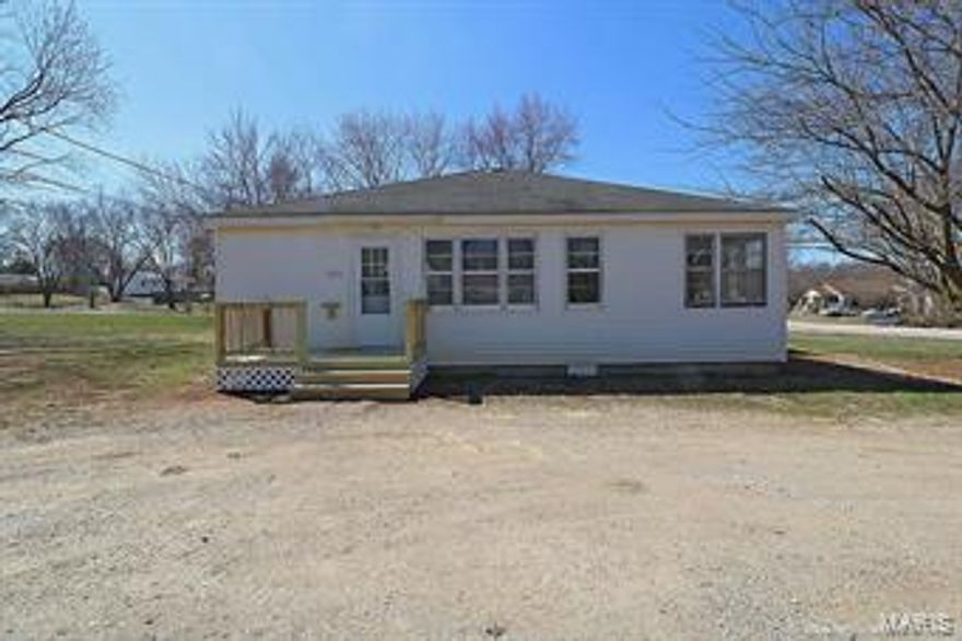 Big rooms & Big yard!  Lots of windows make this a bright and cheery home.  Wood floors and laminate floors & Freshly painted throughout.  Affordable, roomy and darling home. Ready to Move in!