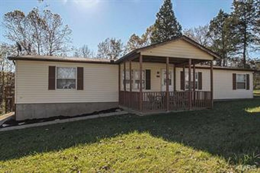 A Must See!! Spacious 3 bedroom, 2 bath home with over-sized, detached 2-car garage on over 2 acres! Enjoy peace and quiet on your covered front porch or invite family & friends over for a bonfire in your private back yard. This home has been remodeled with new flooring, paint, and window blinds. Both full bathrooms have new vanities, mirrors, and lighting. The large eat-in kitchen has plenty of cabinet and counter top space. Relax and watch a movie in your living room or sit and talk with a hot cocoa by the wood-burning fireplace surrounded by built-in bookshelves in the family room. With the separate dining, main floor laundry, and large master suite with a walk-in closet, this home has all you need. Not to mention all of the extra space in the detached garage! Refrigerator, washer, dryer, and 1-year Home Warranty included with sale. This home is just what you are looking for and more, so call before it is too late!!