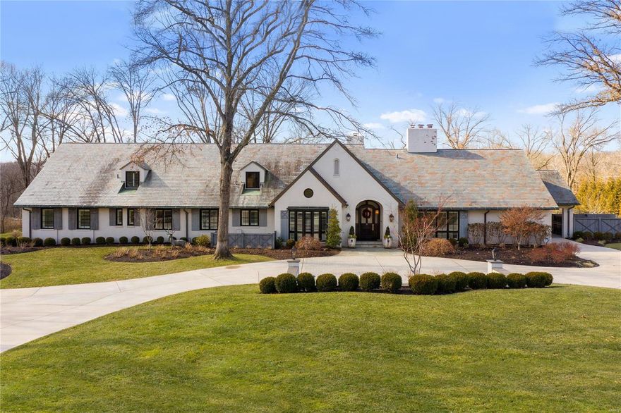 Modern Sophisticated Living in the heart of Ladue. Tucked away on 6 private acres this estate offers Casual Open Living plus all the outdoor amenities you desire. Entry boasts high ceilings & welcoming atmosphere w/ a natural flow into the perfectly crafted living rm & dining rm. Handsome office off entry w/unique barrel ceiling & built-in bkcases. Rich hardwood flrs thru-out! Spacious Great Rm w/ beautiful views of the outdoor living spaces offers 2 french doors.  Large high-end kitchen w/ a touch of elegance. This home is ideal for entertaining & comfortable living! 4 Main floor Ensuite Bedrooms. Private Owner's Suite w/ spectacular view of private acreage plus luxury bathrm & 2 Large walk-in closets. Upstairs features 2 bedrms & Huge family room w/unlimited possibilities. LL includes entertaining space w/ wet bar, wine cellar & 2 exercise spaces & full bath. Breathtaking covered patio w/ stone fireplace wall & built-in grill, pool and spa all overlooking the exceptional grounds. Additional Rooms: Mud Room, Wine Cellar