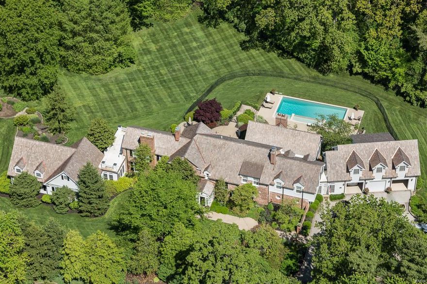 New Exceptional Price: Welcome to this 1928 estate located in one of Ladue’s most sought after neighborhoods Fordyce Lane. Today's active families will marvel at the wonderful use of Living Spaces and Updates. 3 NEWER additions offer 7,444 sq. ft. of functional living space. 6 bedroom's, 7 full & 2 half baths. The West wing features an large hearth/family rm w/3 sides of natural light, family style recreational comfort & an area for casual eating.The South Wing has a 1st Fl Master Suite & finished LL.  The North wing has a 2nd floor ensuite for an Au Pair or a mother-n-law above the large 3 car garage. The Original Homes New England style features were also accented w/a remodeled OPEN gourmet kitchen, backyard pool and patios. A large walk-out LL recreation room w/shower & changing rooms also offers easy walk-out access to the pool. Discerning buyers will relish the high-end designer finishes, gorgeous outdoor landscaping & feeling of privacy amongst the trees. 2.6 acres. Additional Rooms: Mud Room