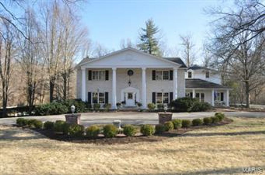 Privacy and serenity are the hallmarks of this picturesque three-acre property in the center of Ladue. This gorgeous piece of land hosts a beautifully appointed   4 bedroom, 5.5 bath home featuring a newer custom kitchen with chef’s stove, double refrigeration - freezer systems ,  including refrigerated drawers, granite counter tops, custom cabinets, wine refrigerator, breakfast bar, and grand sized dining space. The large kitchen opens to a hearth room that over looks the beautiful grounds. This space boasts a gas fireplace, wet bar, lighted cabinetry, entertainment and sound systems. The spacious, finished walk-out lower level with wet bar, wood-burning fireplace and full bath opens to a large patio and pool with waterfall feature.  Enveloped within expansive grounds is a gazebo, pond , and wildlife galore, providing a park-like setting with breath-taking views.