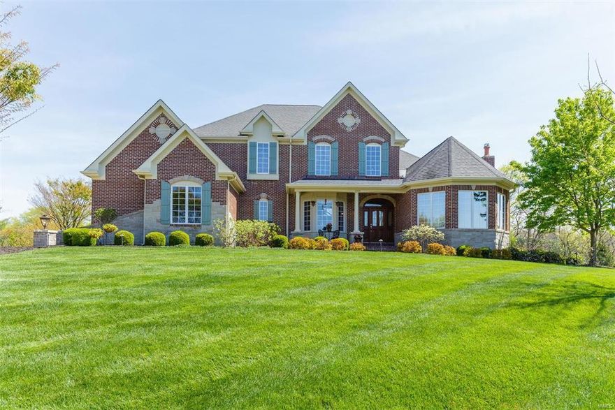 Get inside this gorgeous, custom built home, located near the end of a secluded cul de sac in Sunset Hills. The private 1 acre lot offers an ideal setting for outdoor entertaining. The dramatic entry features 20ft high ceilings, iron balusters & a rotunda. The living rm features a vaulted ceiling & large windows that wrap the turret. You'll be impressed with the den & custom built-ins, see-thru fireplace & 20ft tall bank of windows overlooking this stunning backyard setting! The gourmet kitchen is absolute perfection w/5 burner gas range, double ovens, warming drawer, w-in pantry & 9 ft granite island! Beautiful hardwood flrs extend throughout this space & the family rm opens onto a large, custom deck. The grand master suite includes a fireplace, 18ft walkin closet & luxury bath. All bedrms have en suite baths & walkin closets plus the walk-out lower level offers a 1000sq ft in-law suite w/kitchen & separate laundry. What an extraordinary home, please call for a full list of amenities.