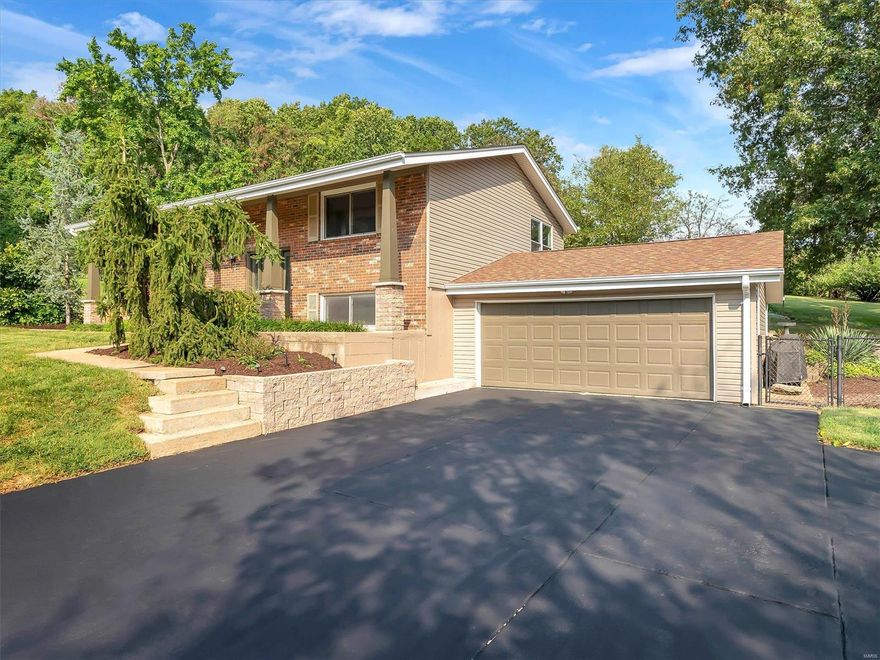 Tastefully updated! 2 primary bedrooms and 3 full bathrooms on a double lot backing to Pleasent Valley Park with 2 car over sized garage! Excellent curb appeal with beautiful landscaping, brick front and stone based columns add to the feel of the perfect covered front porch. Newer roof, vinyl windows, vinyl siding, soffit and facia! Inside features many upgrades such as an open floor plan, wrought iron stair spindles, hardwood & tile flooring, bright white handcrafted kitchen cabinets with a center island breakfast bar, fresh paint and lighting. The lower level offers a fantastic second primary suite with massive walk-in closet, an on-suite bath, an office area, pool table / could-be theatre room, and laundry. This home is very clean and well maintained, backs to trees for privacy and has a massive patio area for perfect back yard entertaining! Come see this one quickly before it's gone!