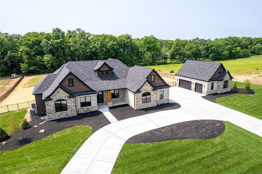 New Construction, Defiance, Francis Howell Schools! 3-Bed, 2.5 Bath, 3-Car Side Entry Garage. This AUDEN-RANCH Boasts more than 2,790sf of all custom finishes and luxury amenities that will satisfy your taste in current design trends. Brick & Stone Front Elevation; Stone to ceiling Great Room Gas Fireplace; Quartz counter tops throughout.  Select your finishes from our extensive line of luxury finishes and builder preferred vendors. Brand New 16 Home picturesque cul-de-sac development, private country setting, between Defiance, New Melle and Lake St. Louis, and only 15 minutes from Chesterfield Valley. Close to August Busch Memorial Conservation Area, Weldon Spring Conservation Area, Broemmelsiek County Park, the Katy Trail and Missouri Wine Country.
*Note: Listed price does include the Lot Premium.