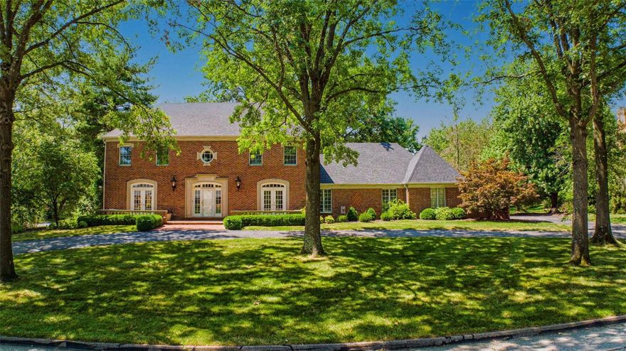 Stately 2 story in Town and Country, located on sought after private lane off Topping Road offers incredible oasis with private pool and stunning curb appeal. Gracious hardwood foyer leads to elegant dining room and living room both with French doors, family room with gas fireplace, built-in bookcases and wet-bar, large eat-in kitchen with double oven and granite counters, main floor laundry. Quality craftsmanship and gorgeous moldings throughout.  Prepare to be amazed by the private backyard oasis!  Large swimming pool, beautiful brick patio with fountain. Spacious primary suite with double sink, separate shower and tub and walk in closet.  3 additional bedrooms and 2 more full baths upstairs.  Nicely finished lower level offers additional living space with rec room, office area, and plenty of storage. 3 car garage and full house generator. Additional Rooms: Mud Room