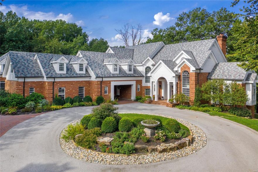 Magnificent estate in exclusive Wills Trace subdivision tucked away on 5.39 acres of unparalleled seclusion. Private, gated circle drive, stately brick exterior, spectacular stonework and landscaping. Classic, traditional details and updates throughout interior: extensive millwork, 9' ceilings, chef’s kitchen with custom cabinetry and commercial grade appliances and attached hearth room. Approx. 13,000 sq. ft. of living including 9 bedrooms, 8 full and 3 half baths, 10 fireplaces. Elegantly appointed - formal study, sunken living room and dining room off foyer. Main floor master with sitting room and luxury ensuite bath. Additional master suite upstairs. Two story guest apartment. Six car garage, porte cochere. The secret garden could be the perfect area to add a pool. Expansive views of nature and subdivision pond. Excellent location in the heart of West St. Louis County. The opportunity you have been waiting for! Too many details to list–reference attachment to disclosures for info.