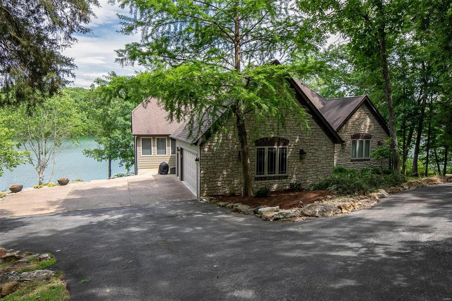 INCREDABLE VIEW!!! EASY LAKE ACCESS!!! PRIVACY!!! This is a one of a kind home situated on a gently sloping lot with easy access to the waters edge. Situated amongst towering oak trees is a little piece of paradise waiting for you.  There was no spared expense in the thought process when creating this perfectly positioned home to achieve every view imaginable. This home offers 5 bedrooms, 4 baths, a beautiful stone fireplace, custom cabinets, and incredible hand scraped wood floors!  If your in the market for a fantastic lake property that has it all...look no further.  See for yourself with a tour of this wonderful offering. Property is being offered turnkey to include all furnishings and pontoon boat.