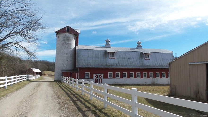 317+/- Acres of Jefferson County's finest, rolling hills, bottom lands and natural beauty. The land has been used as a horse farm. The buildings include, an indoor riding arena, a horse barn (numerous stalls), tack room, grain room, attached grain silo, 2nd floor hayloft. Also there are storage sheds, tractor sheds, and outbuildings. There is some fencing around the barn area, the barn area has electricity and water. The land has two small wet weather streams, and a larger creek (Plattin) that touches or flows through property. Property located only 5 minutes from Festus/Crystal City.
