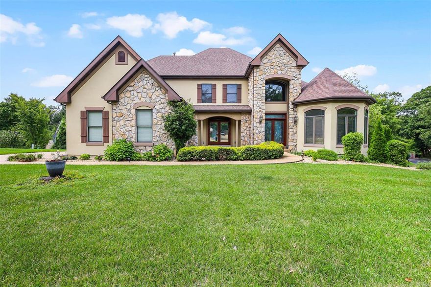 Gorgeous Kirkwood custom 1.5-story dream home opportunity. 2-story stone fireplace with upgraded millwork throughout, open flowing floor plan. The dining room boasts mahogany wood detailing, and the living room features a custom-painted ceiling and angled walls. Spacious kitchen with newer appliances, center island, upgraded cabinetry, breakfast bar, and newer custom-built sunroom. Fantastic natural light throughout. The main floor master suite has coffered ceilings, lg tube, lg closet, and a separate walk-in shower. A two-story entry foyer and a beautiful staircase lead to the upper level with tall ceilings, jack and jill bath, one private bath, and new hardwoods throughout. The finished lower-level walkout matches the top two levels, featuring a second fireplace, wet bar, rec area with projection TV, and 5th bedroom. Walk-in closets, recessed lighting, main floor mudroom, tall solid core panel wood doors, flagstone tile, built-ins, large lot, cul-de-sac, and side entry 3-car garage. Additional Rooms: Mud Room