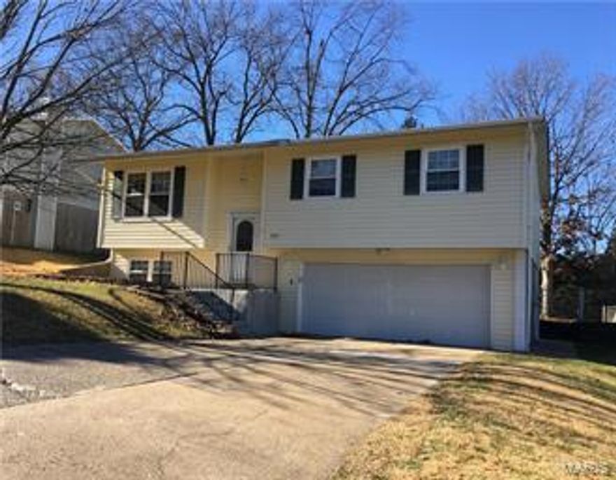 Here's very affordable split level home with an attached two car garage in Crystal Woods Estates in Arnold. It has 3 bedrooms and 1.5 baths. The kitchen/breakfast area has pergo flooring, a dishwasher, double sink, electric range with a built-in microwave and a garbage disposal, and a french door that leads to a large concrete patio. Lower level featuring gorgeous family room and a laundry room with extra storage. Low maintenance vinyl siding, newer insulated windows, fenced in back yard and a storage shed.Great location convenient to highways, shopping and parks.Come check it out before its gone!