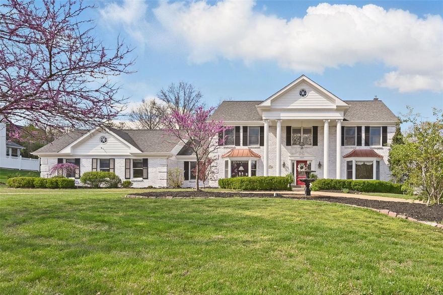 Perfect location! This gracious Town & Country home is nestled on a large, beautifully landscaped lot with an inviting circle drive. The main floor features a dramatic two-story entry, formal dining room area, and an open-concept kitchen with a large island and adjoining breakfast area. The great room with fireplace offers warmth, while the main floor bedroom ensuite and laundry room add convenience.  A light-filled 3-season room opens to a stunning backyard retreat with a sparkling in-ground pool and serene patio ~ Perfect for entertaining!  Upstairs, find three spacious bedrooms including a private primary ensuite. The finished lower level is perfect for entertaining with a large recreational room, fireplace, bedroom / bonus room, full bath, and abundant storage. 3-car garage. In-ground sprinkler. Blending comfort, style, and function, this home is perfect for refined everyday living and memorable entertaining. New dual fuel heat pump systems installed @ 1.5 years ago Additional Rooms: Sun Room