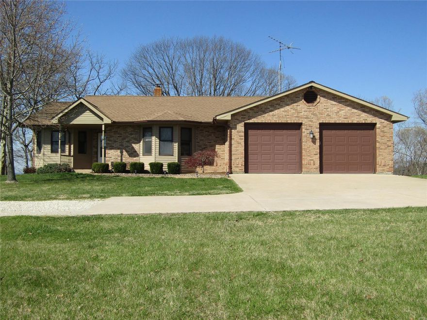 Wow! Check out this 3 Bedroom, 3 Bath Brick Home on 25.2 Acres with Views Overlooking Hermann and the Surrounding Countryside! This Wonderful Home Includes a Comfortable Living Room, Equipped Kitchen with Island and Custom Cabinetry, Separate Dining Room, Master Bedroom Suite, Hallway Bedroom and Bath and Loft Bedroom. Enjoy the Views from the Large Deck with access from the Breakfast Room. The Lower Walkout Level is Mostly Finished with a Full Kitchen, Family Room with Wood Burning Brick Fireplace, Full Bath and Recreation Area! Hardwood Floors, Ceramic Tile and Carpet Throughout! Whole House Generator Comes with the Home as Well! The Grounds Include a 16x32 Heated Pool with an Automatic Cover and Patio, Nice Outbuilding with Bathroom and Attached Greenhouse, Gazebo Overlooking 3 Ponds and a Walk Bridge, and Lots of Beautiful Landscaping. This Property has Access from Both Highway H and Boy Scout Road. Call Today for Your Private Viewing! Please No Drive-by!