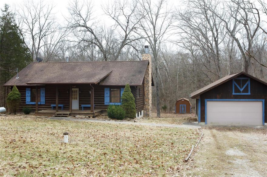 YOUR OWN PRIVATE COUNTRY RETREAT WITH AN AMAZING LOG HOME! Located in sought-after Sunny Acres Estate Subdivision. Beautiful 3+ acres of gentle sloping land with yard that backs to woods and a serene creek in back of property. Horses are welcomed! Well-constructed custom built log home with 10" logs; open concept living area with gorgeous stone wood burning fireplace and circulating blowers to generate lots of heat; deck off family room allows you to enjoy the views and wild life of this fantastic property; basement includes large egress windows and sliding glass door that allows for much light, as well as rough-ins for an additional bathroom and fireplace......a great area to add your own finishing touches and create additional living space; large 2 car garage; utility shed; access to subdivision lake with great fishing; and Don Robinson State Park approximately 1 mile away! Neighboring lot of 3+ acres is also for sale if interested in expanding your property to 6+ acres!