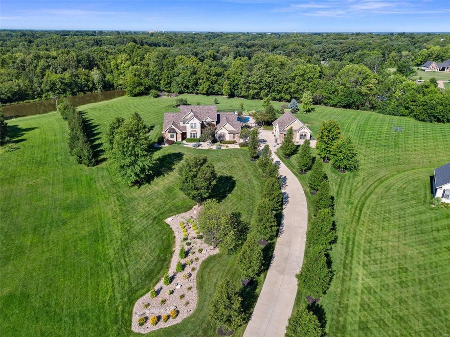 Exquisite 1.5 story, 3.01 AC tree lined cul de sac lot, 5 car gar (6 w/lift), inground salt water pool, and an 18x20 pool house w/full Kit in a gated community! Enjoy a picturesque approach, brick/stone façade, O/S side entry gar, detached gar and lawn irrig. Features inc 4 BD, 6 BA (4+2), a 2 story Entry and Grt Rm, Andersen Low E wndws, remote cont window shades, 3  FP, 9 ft clngs, DR, hardwood flrs, huge window at the Kit sink, solid surf c-tops, Viking appl, island, FR w/bay and coffered clng, main flr laundry w/cab-sink-ice maker, MAIN FLOOR PRIM, Lux Prim Mstr Bath, 2 W/I closets, 2 Hi-Effic HVAC, 2 HWH, new AC (Aug 2024), water sftnr and bath in the LL. Upstairs has 3 BD, one en-suite and 2 w/shared bath & W/I closets. The attached gar is O/S (29’2Wx 22’5D). The detached gar is spectacular (28’5Dx29W) w/tall doors (18x8/7x8), car lift, compressor w/2 tanks, 50 AMP serv for RV needs, pull down steps and full bath. The 33,500 gal, heated pool (see updates) comes w/hard cover. WOW! Additional Rooms: Sun Room