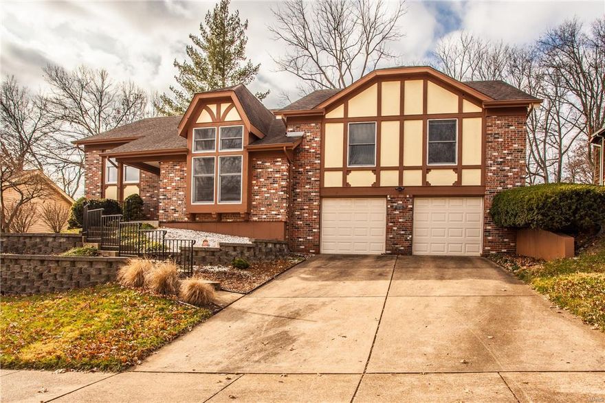 Are you looking for  home with modern updates? Neutral decor?  Large fenced backyard?  And an award winning school district?  Look no further.  Fantastic 4 bedroom , 3 bath house with great space and vaulted ceilings.  Walk in to the open entrance foyer and sunken living room with over-sized window.  The large main floor family room conveniently opens to the breakfast area and kitchen.  The master bedroom suite has a large walk-in closet, updated master bath with double vanities. Main floor has 2 additional bedrooms and an updated hall bath.  Lower level has laundry, an additional bedroom with newer cork floors and an updated full bath.  Great potential to finish the lower level and add your personal touch!  The newer cedar deck and fenced backyard that backs to trees has plenty of space for entertaining.