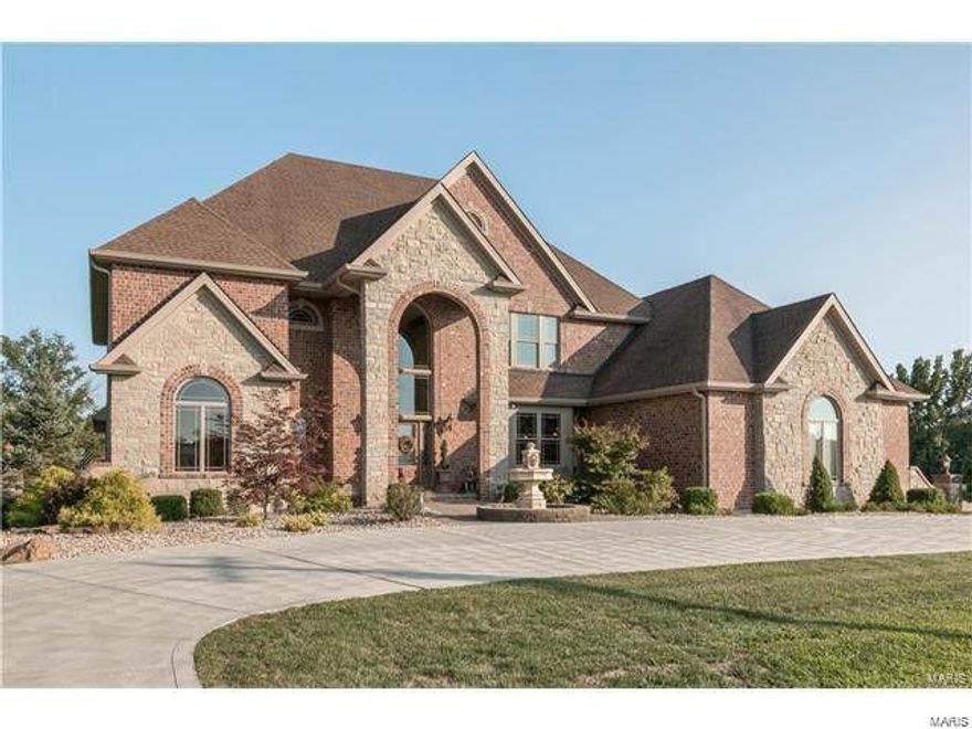 Priced to sell!! Luxurious custom built home on 5.97 acres with professionally landscaped grounds that look like a resort. This private oasis has been impeccably maintained and is move in ready!! 2-story entry leads you into great room with soaring windows, gas fireplace, & built-in bookshelves. The gourmet kitchen features a huge center island, high-end appliances, granite and opens to a spacious breakfast room & hearth room. The kitchen has amazing views overlooking the beautiful pool and 2 acre stocked lake.  Main floor master suite includes a luxury bath and private access to the pool area. Extensive mill work and moldings throughout add to the warm and gracious feel, yet enhance the features today's buyers require. Convenience is key with a laundry room on the main and upper levels. All bedrooms have bathrooms. The 4 car over sized garage can handle just about any hobby you have. Partially finished LL has theater room with stadium seating and 2 bathroom rough ins. Additional Rooms: Mud Room