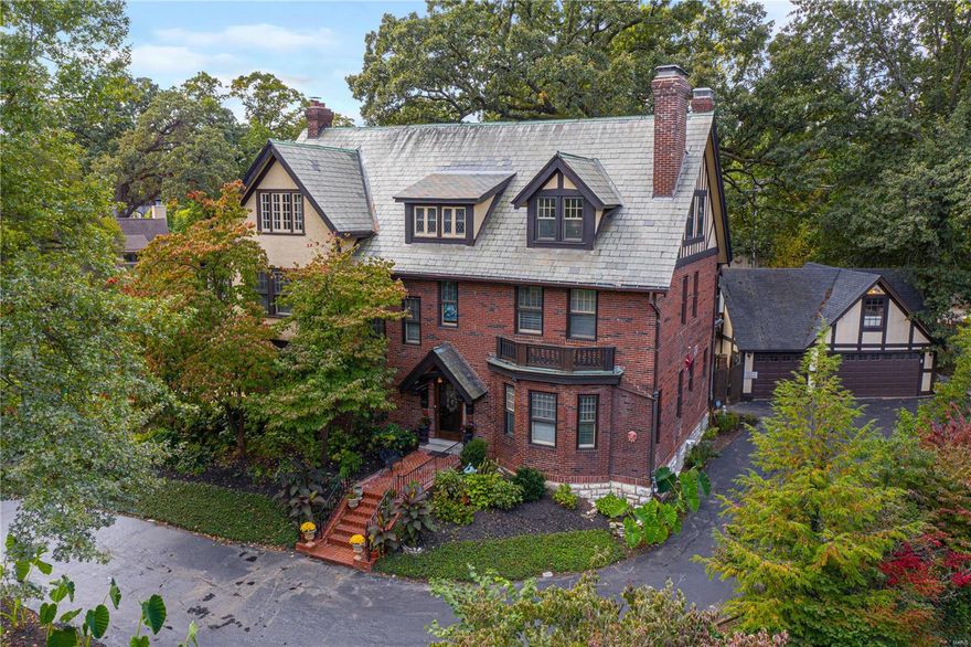 This gracious 5,173 sq. ft. home sits upon a hill in the popular Hampton Park neighborhood. Residents enjoy walking in their neighborhood & being centrally located with the bonus of larger lots than are available in Clayton. The living room is spacious & bright with a gas fireplace & rich architectural details. Off of the living room is a sunroom that looks out onto the yard & opens to a covered flagstone patio. The dining room is beautiful with a wood-burning fireplace. The kitchen has been updated with new cabinets, granite counter & tile floor, though also features the original butler’s pantry & Virtolite tiled walls. The 2nd floor has a primary bedroom with a large walk-in closet in addition to other closets & a sunroom. The primary bedroom bathroom has been updated with new vanity, tile work & jacuzzi tub. The 2nd & 3rd floors have 5 more bedrooms & 2 full baths. The 3rd floor also features a billiards room. Detached carriage house with 3 garage spaces & a living area above.