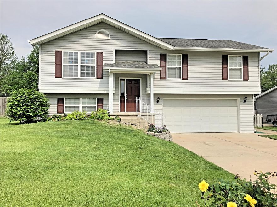 THIS CHARMING HOUSE WILL GO FAST W/ ITS AMAZING LOCATION, Spacious split foyer home with an open floor plan great for entertaining! Wood Laminate floor through whole main level, Brand new Carpet on stairs and Recreation room! 3 Bedroom 3 Full Bath! Large oversized 2 car garage waiting for any guy that complains that he can't fit a truck into a garage or simply wants his very own "space" for all those tools and toys. Entertain on the Massive Deck just off the breakfast room. Stairs to oversized Party Patio and Fenced back yard! 6 Panel doors throughout, Kitchen Refrigerator, Washer and Dryer to stay! Spacious Lower Level Recreation room with Full Bath! Bring your final touches to make this House into a Home! Ft. Zumwalt West Schools!